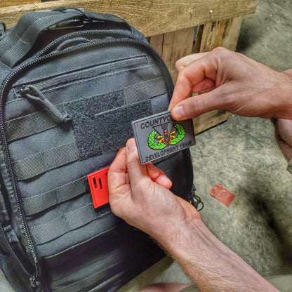 Subdued Storage Pocket Patch: A coverable two layer Velcro patch with hook and loop sides.